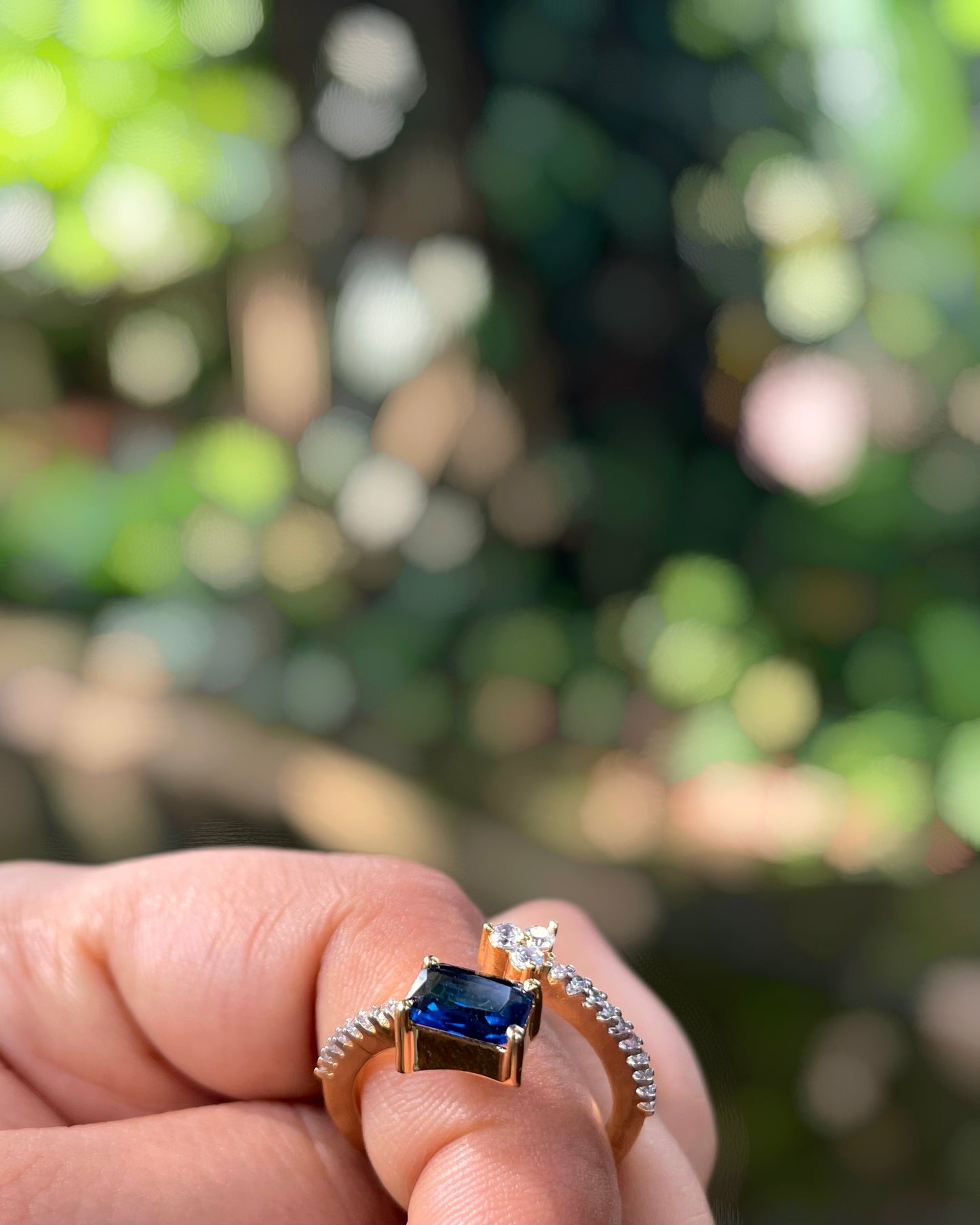 Ocean Vine | A Contemporary American Diamond ring with a striking blue stone, thin white-stone strand with delicate leaflets With 2 Tone Plating