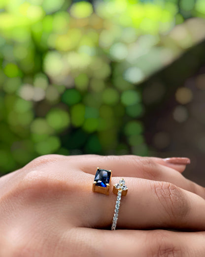 Ocean Vine | A Contemporary American Diamond ring with a striking blue stone, thin white-stone strand with delicate leaflets With 2 Tone Plating