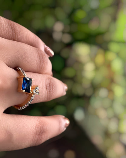 Ocean Vine | A Contemporary American Diamond ring with a striking blue stone, thin white-stone strand with delicate leaflets With 2 Tone Plating