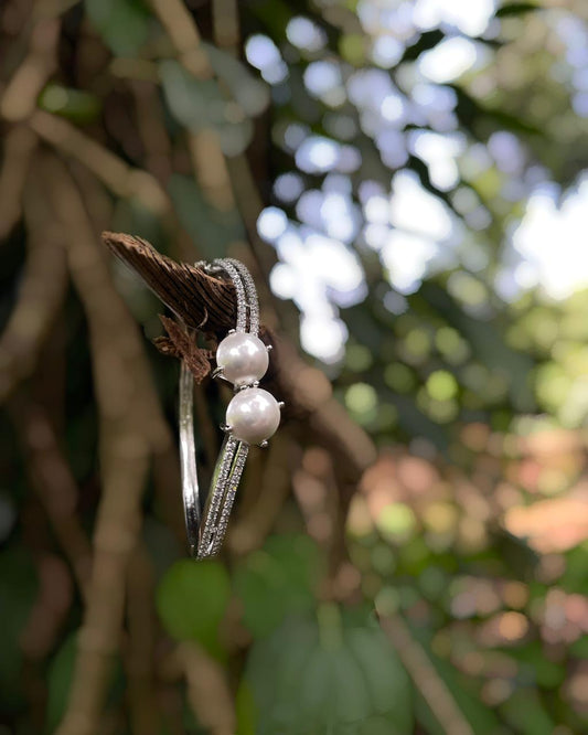 The White Muse | A rhodium-finished kada with twin pearls and fine American Diamond stones.