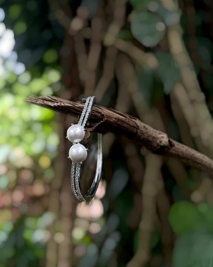 The White Muse | A rhodium-finished kada with twin pearls and fine American Diamond stones.