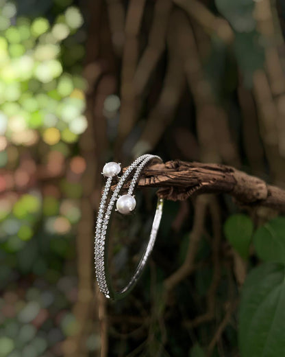 Ivory Arc | A rhodium-finished kada with twin pearls and fine American Diamond stones.
