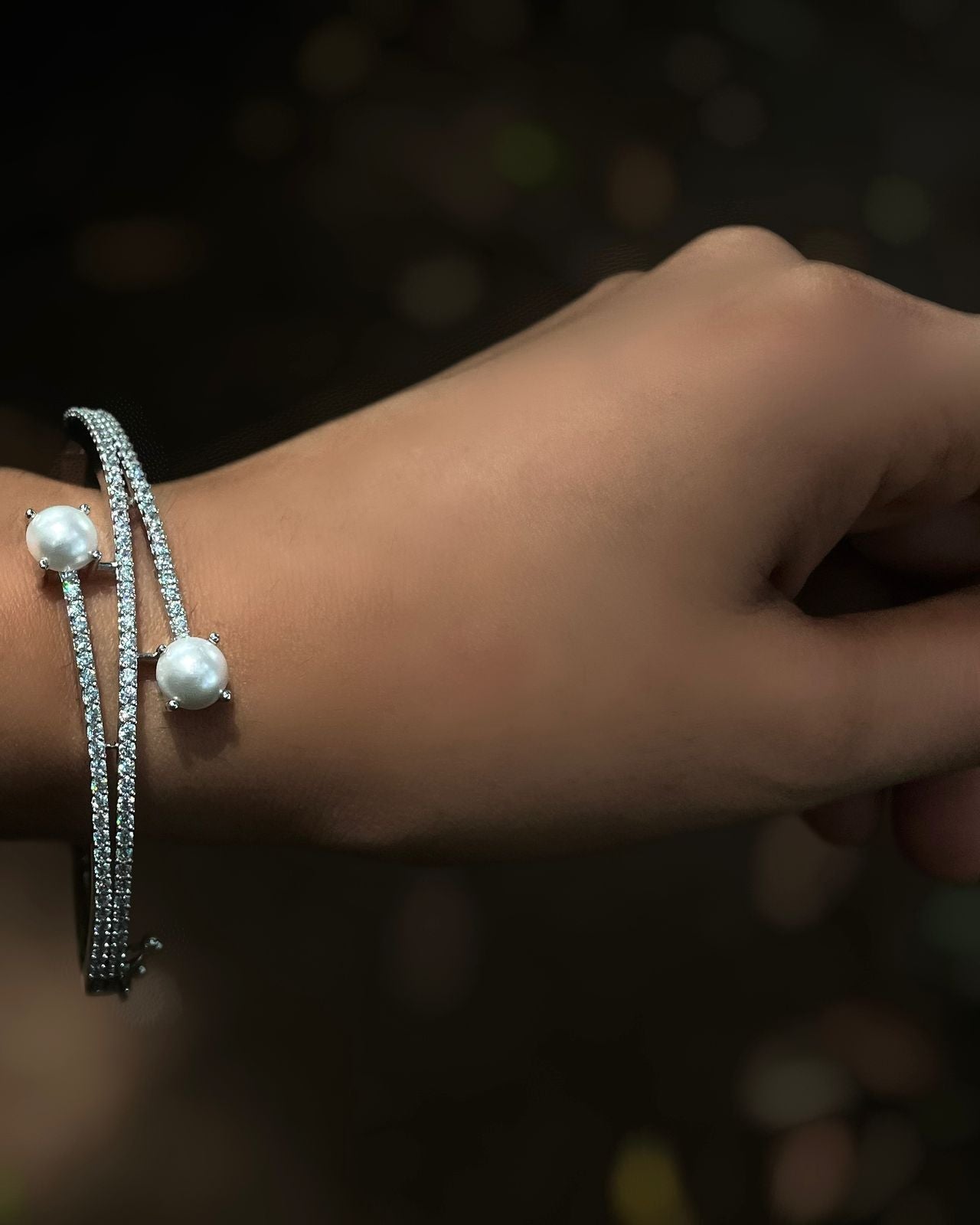 Ivory Arc | A rhodium-finished kada with twin pearls and fine American Diamond stones.