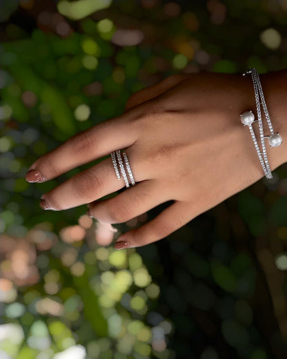 Ivory Arc | A rhodium-finished kada with twin pearls and fine American Diamond stones.